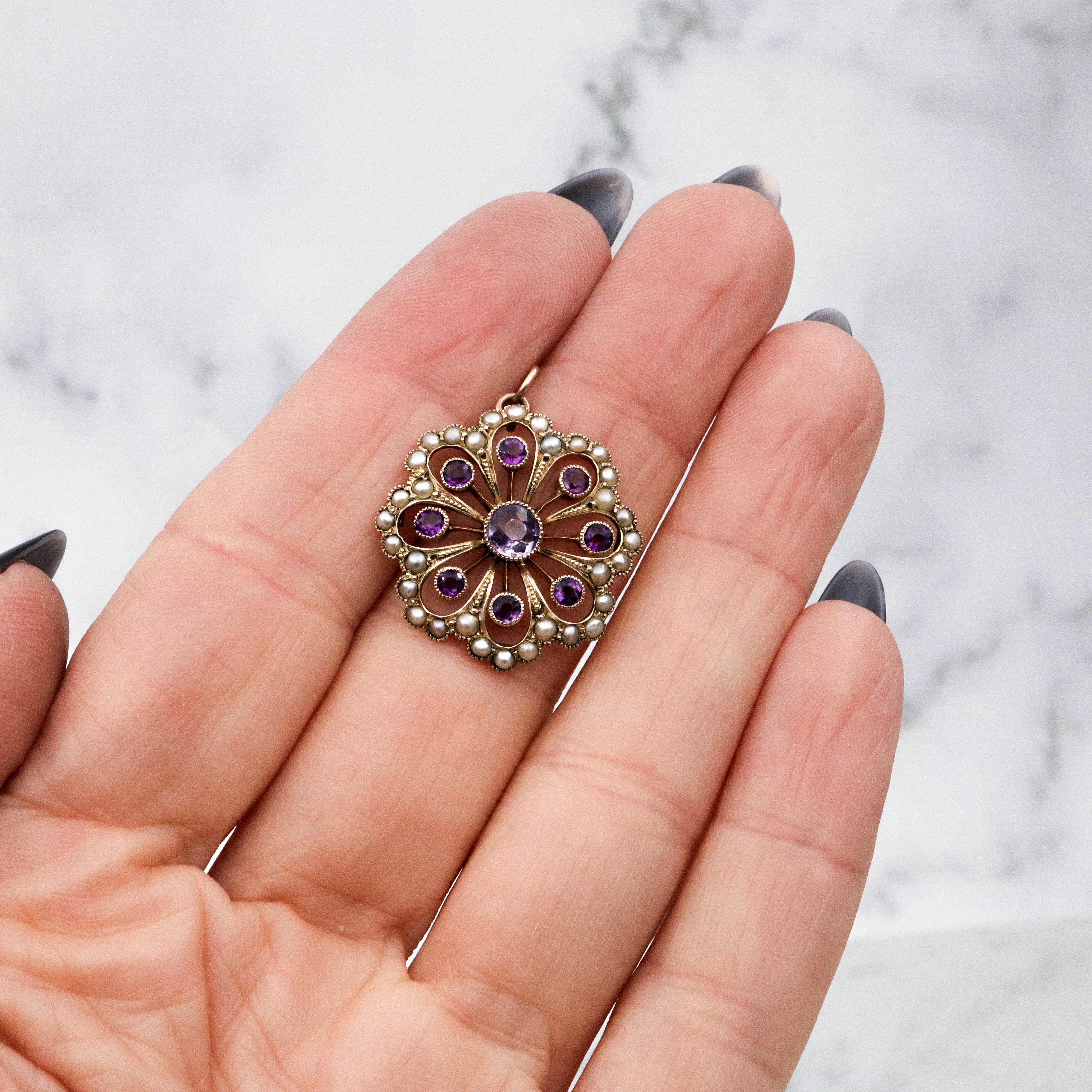 Antique early Victorian 9k gold, amethyst and split pearl flower pendant